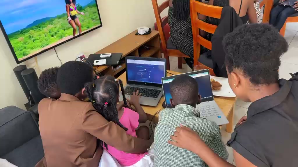 Parent and children learning at home on laptops